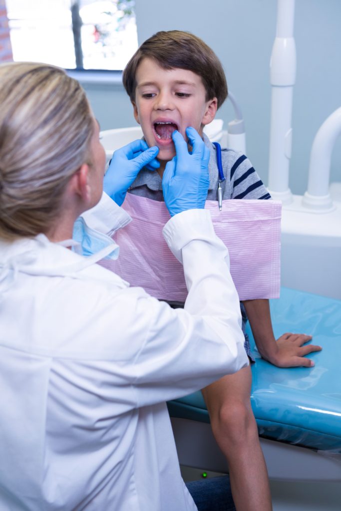 Doctor helping child