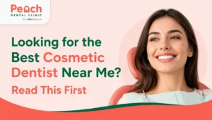 News Corner Smiling woman sitting in a dental chair representing cosmetic dentistry with the text "Looking for the Best Cosmetic Dentist Near Me? Read This First" by Peach Dental Clinic.
